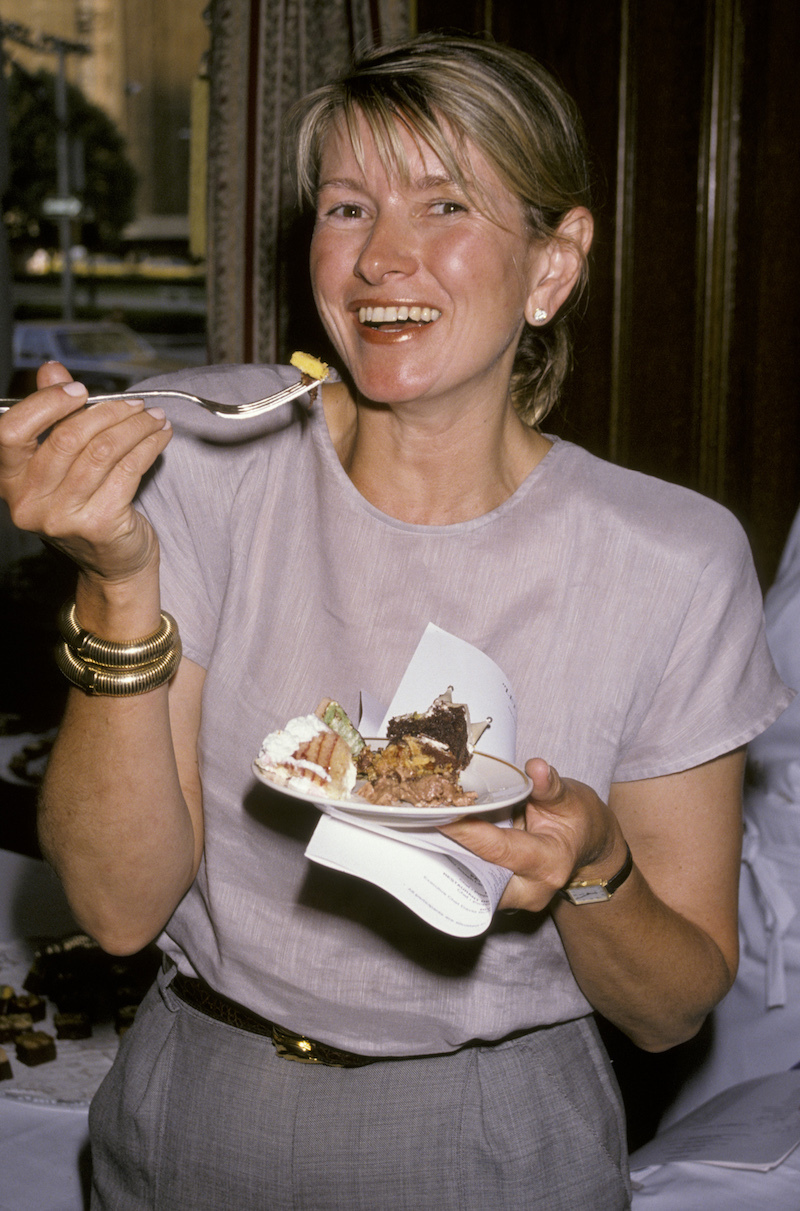 Martha Stewart eating cake during a National Pastry Competition event in 1990