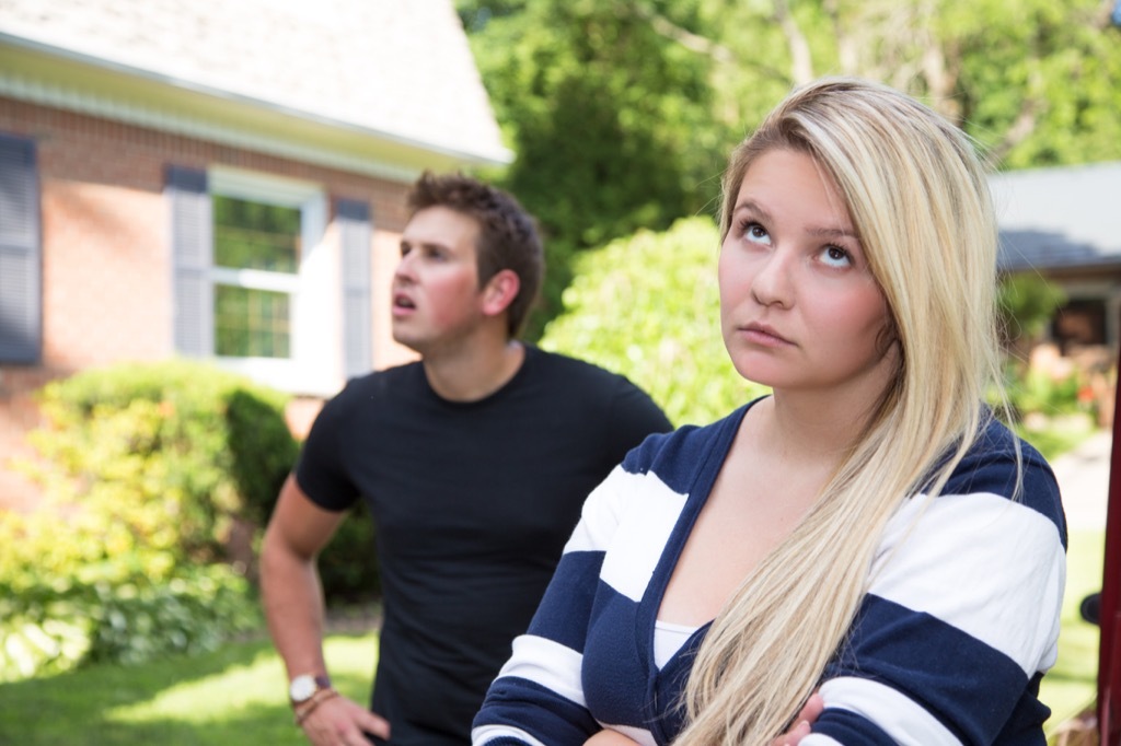 Girlfriend is rolling her eyes during an argument with her boyfriend.