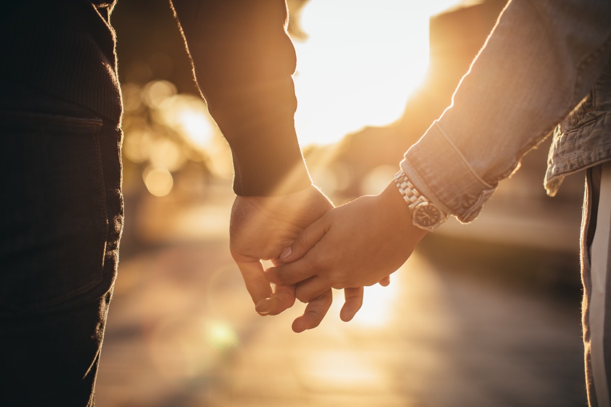 Man and woman holding hands