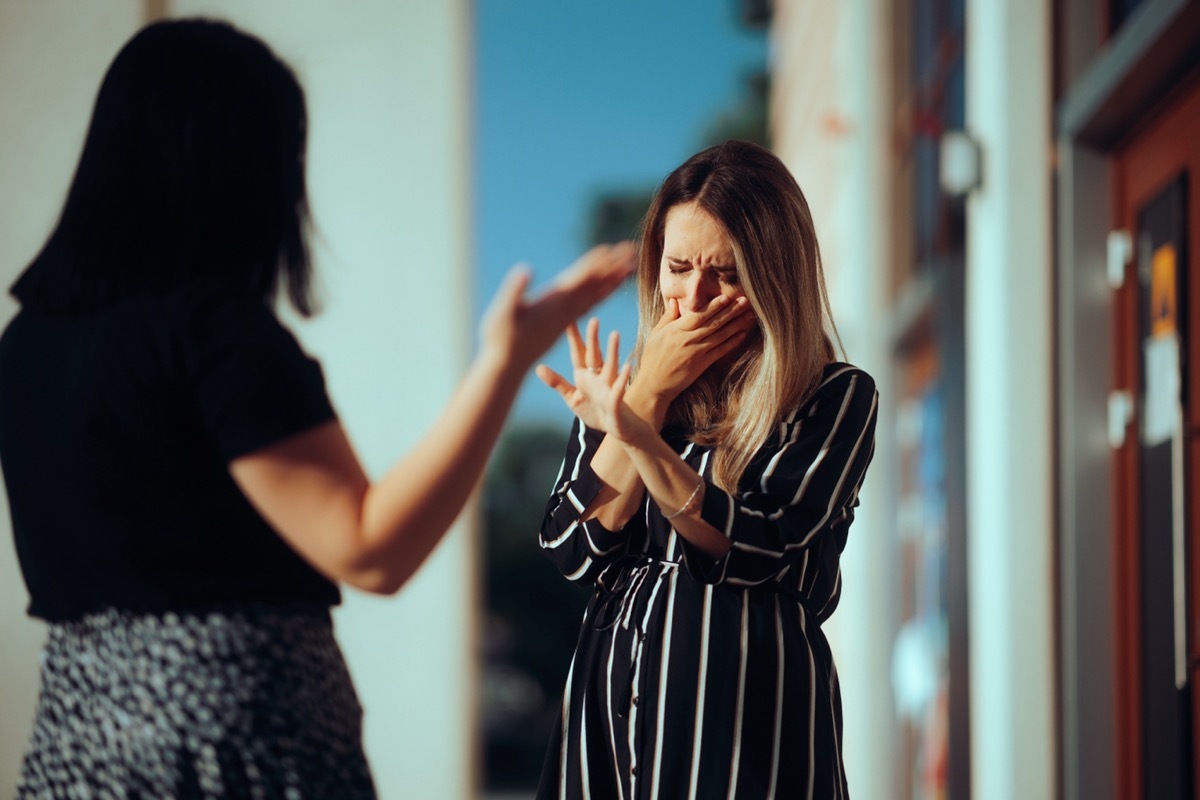 woman crying because friend is being mean