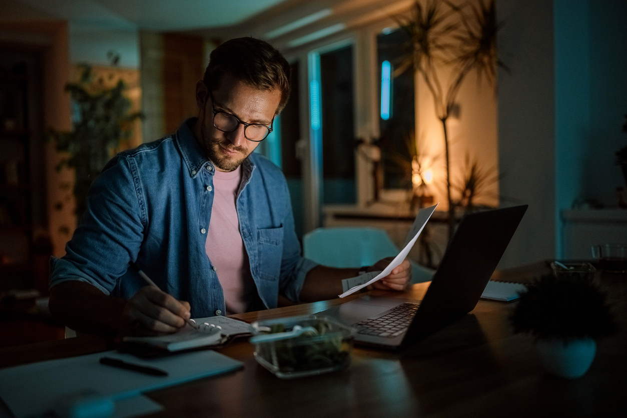 Adult man working late into the night.