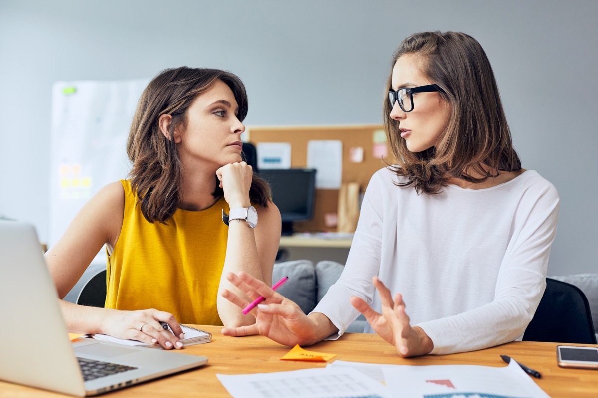 coworkers having serious conversation