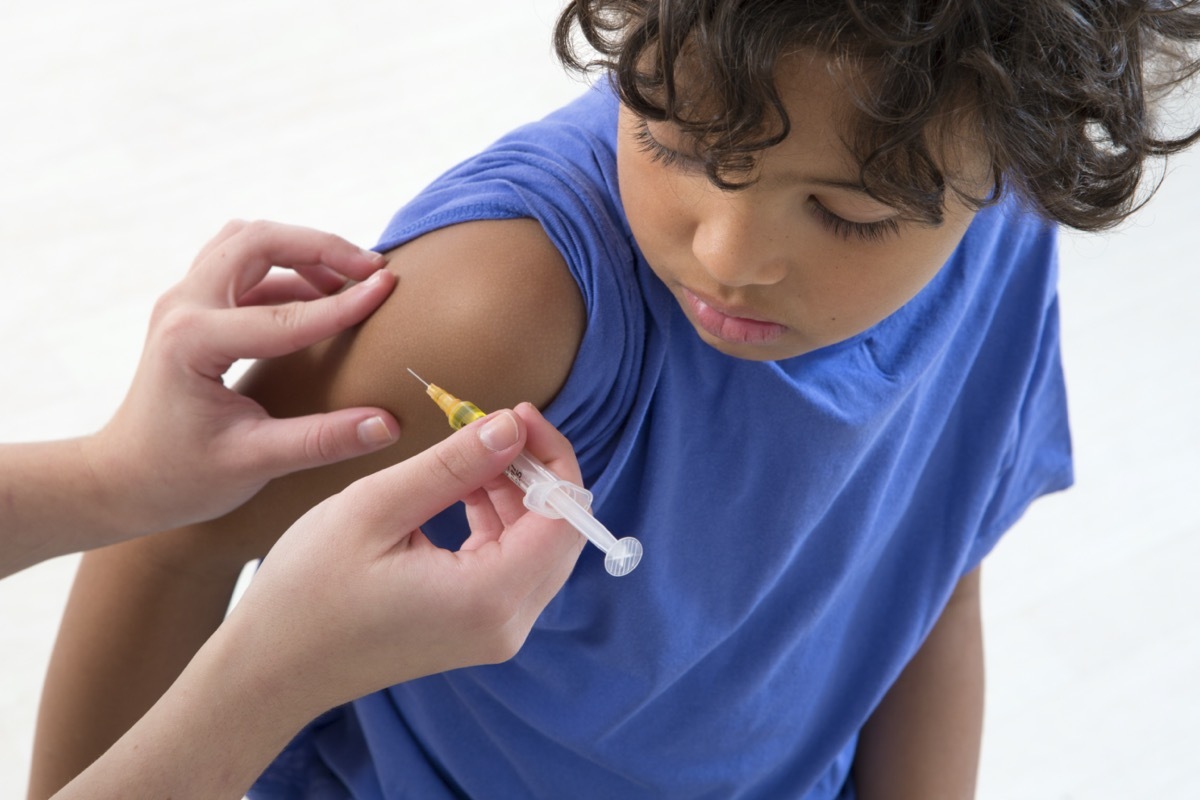 Little boy receiving a vaccination shot