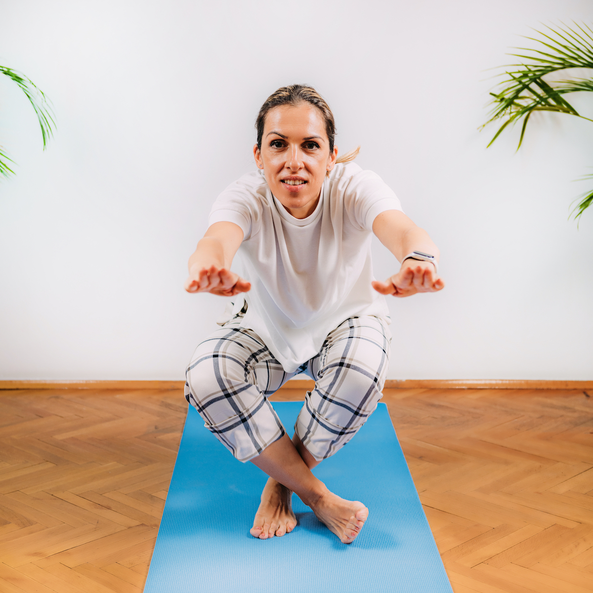 Woman Doing Sitting and Rising Test at Home