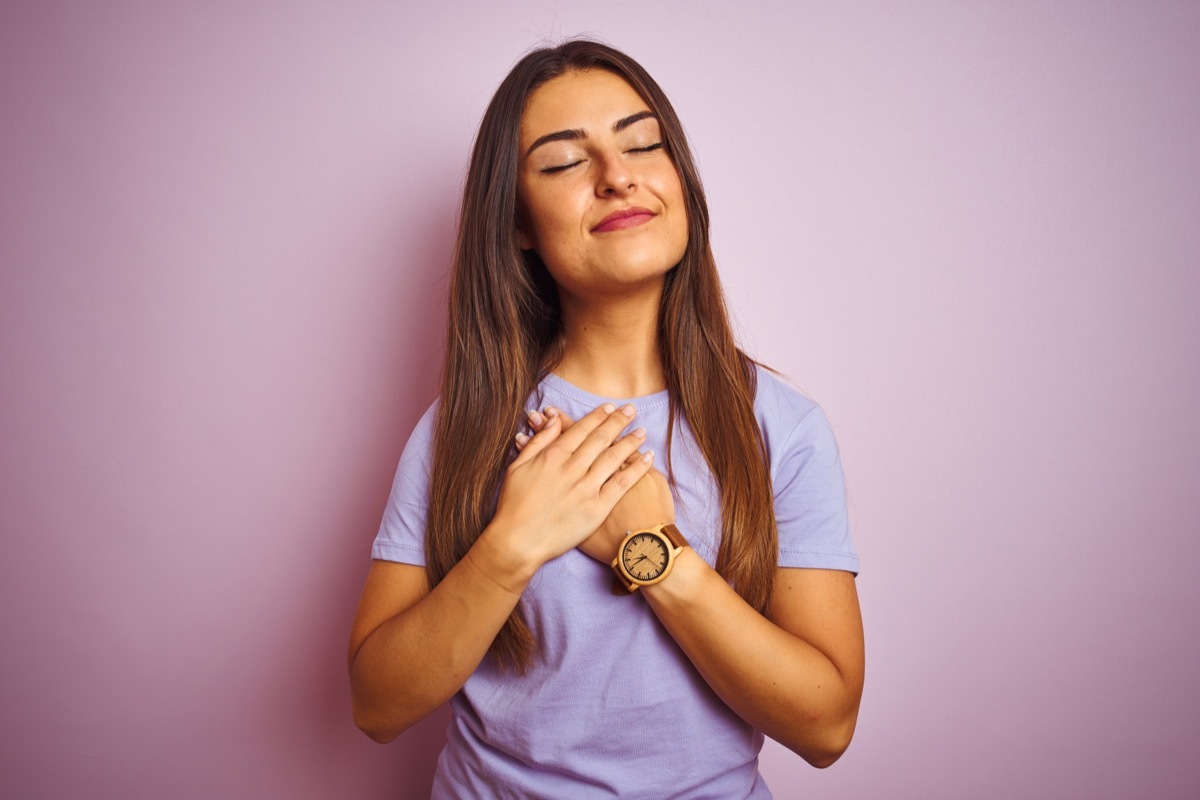 woman with hand over her heart