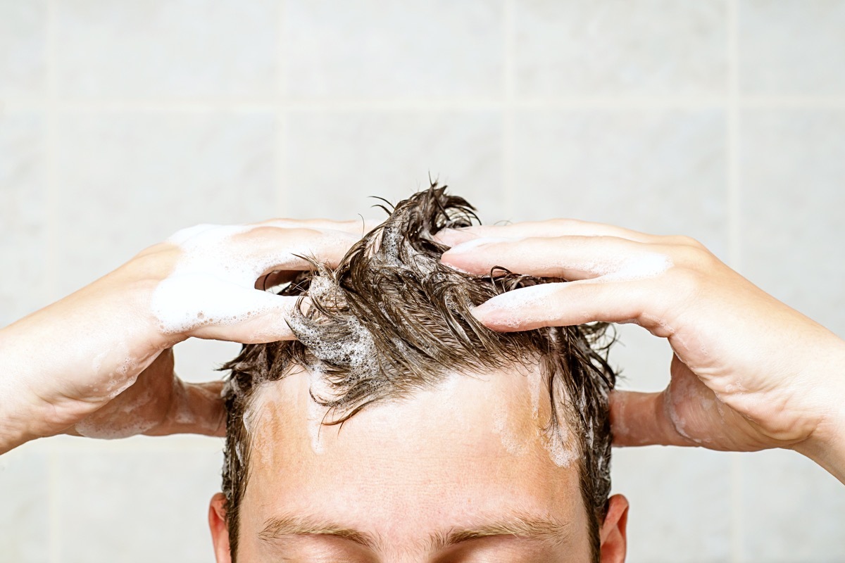 man washing his hair