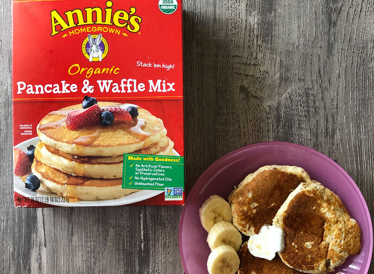 box of annies pancake mix with plate of pancakes