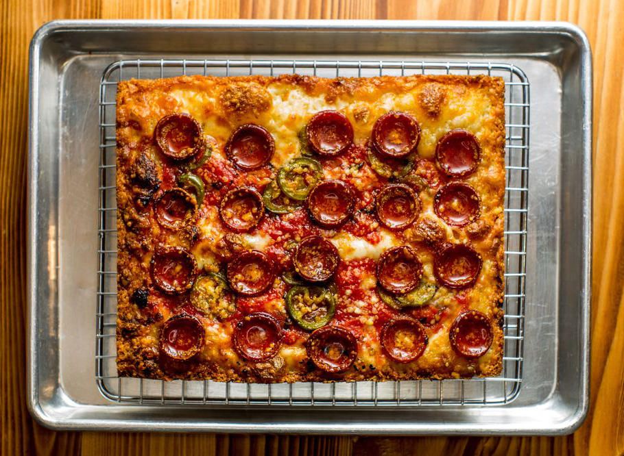 Detroit style pizza with large pepperoni slices from emmy squared