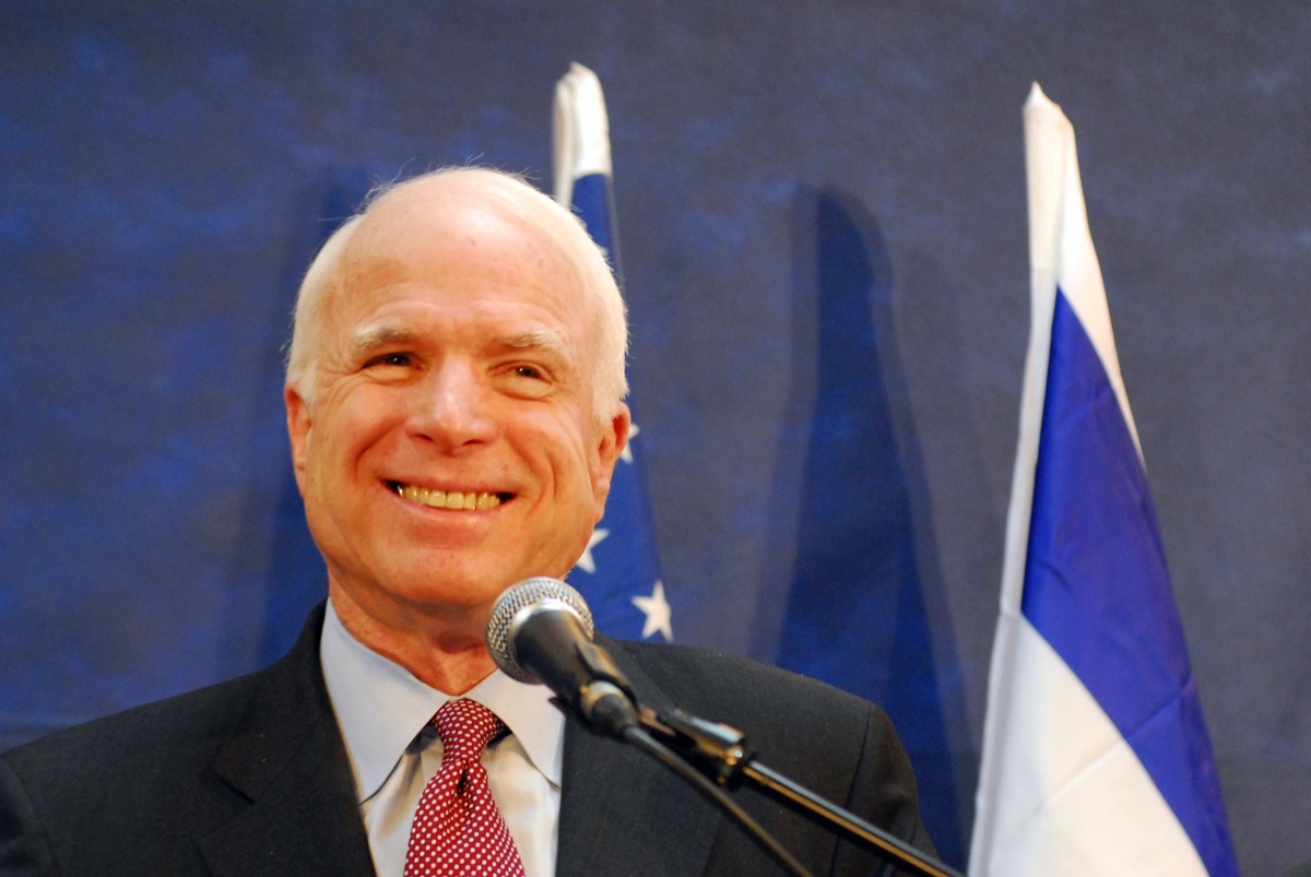 american politician john mccain at podium 