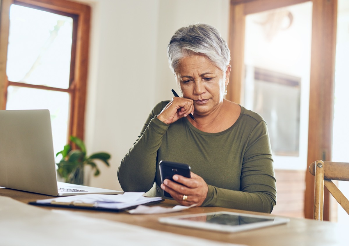 Woman looking at bills