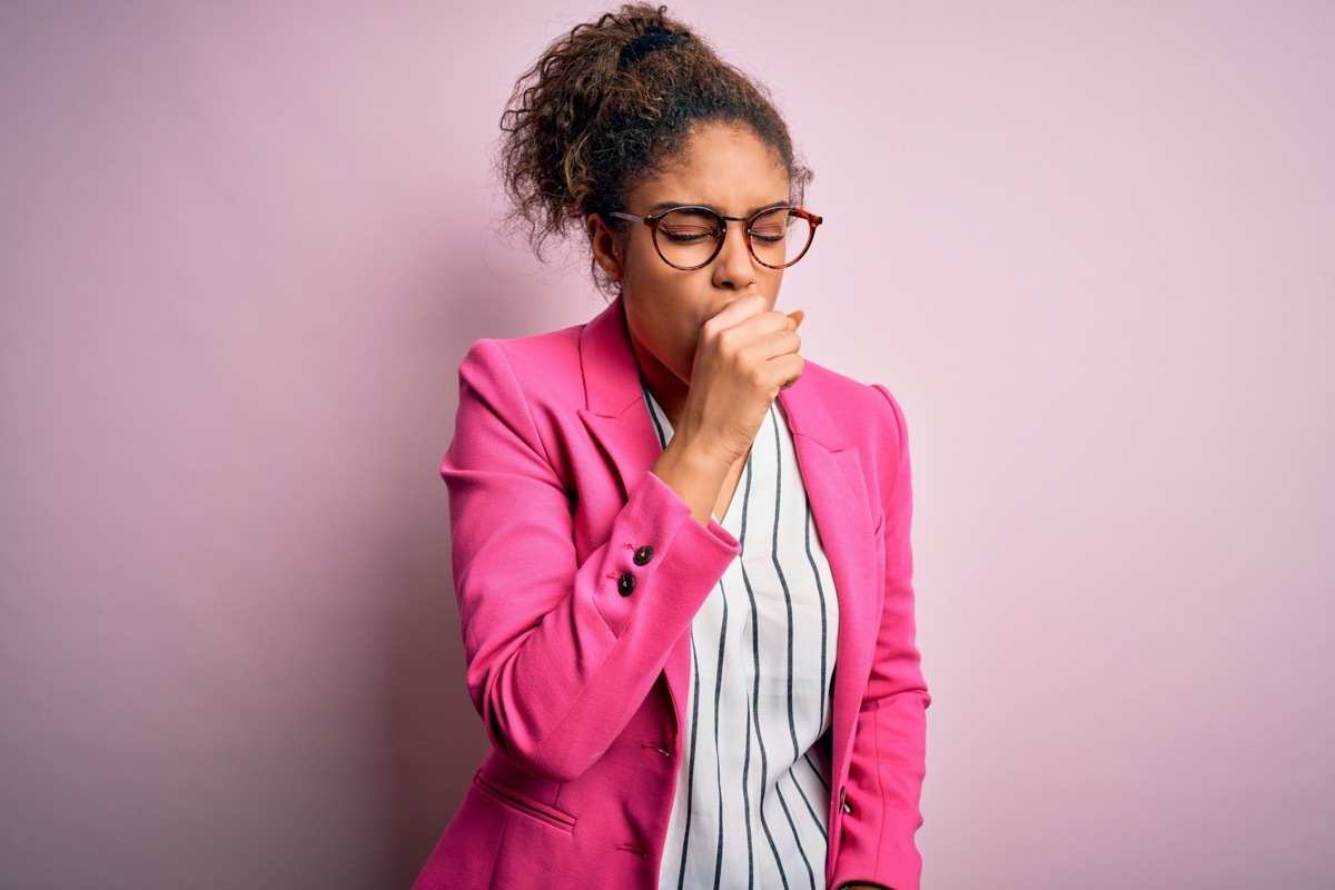 Young woman coughing