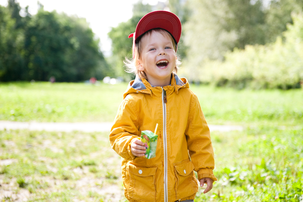 kid drinking a juice box