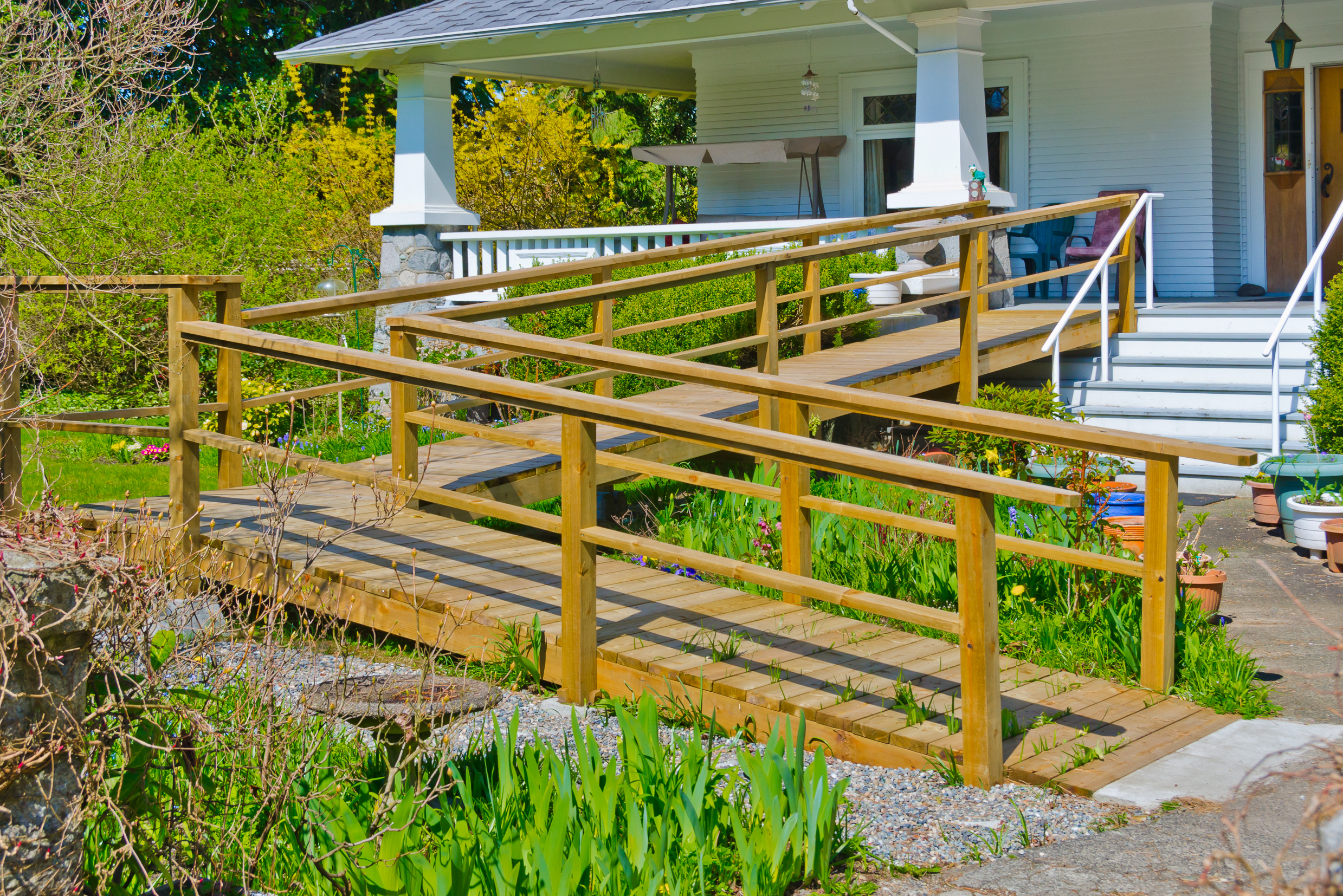 House front porch with long wheelchair ramp to yard