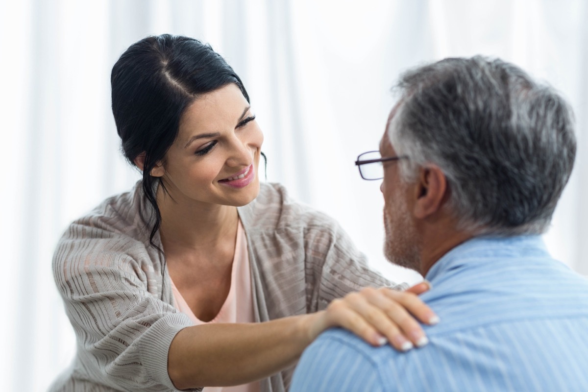 Young Woman Looking Out for Old Man