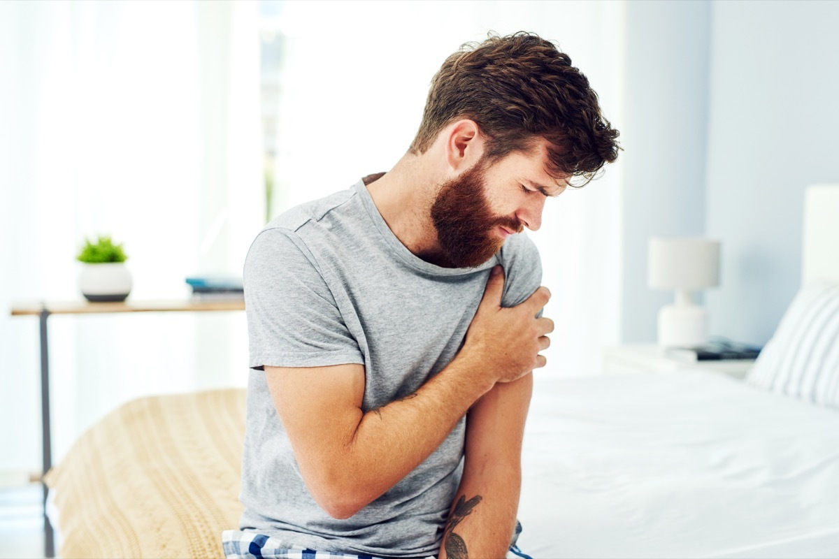 Cropped shot of a young man experiencing discomfort in his upper arm