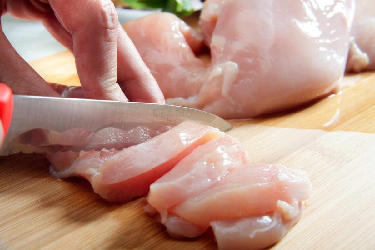 raw chicken being cut with a knife, second uses for cleaning products