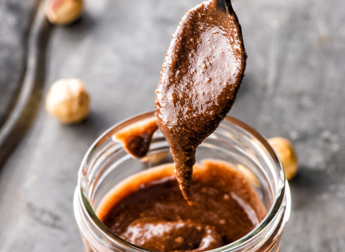 homemade hazelnut spread in a jar with a spoon