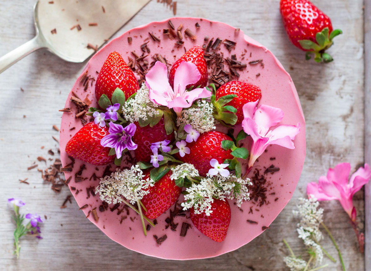 whole vegan strawberry cheesecake topped with flowers