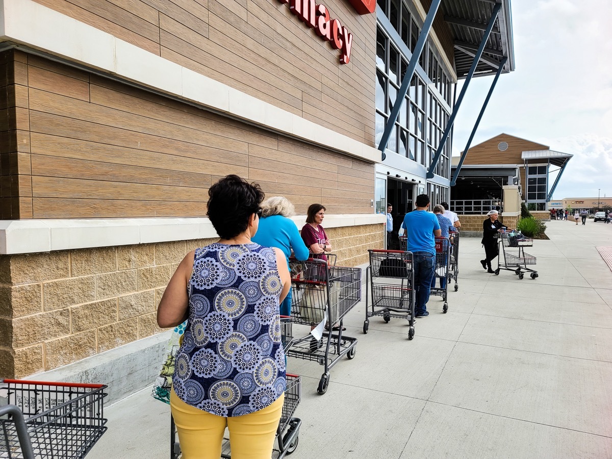 HOUSTON, TEXAS - March 13, 2020: Waiting Lines at Grocery Store due to Hoarding a Variety of Supplies, (such as water, paper products, eggs, and frozen food) in Pandemic Scare at a Walmart.