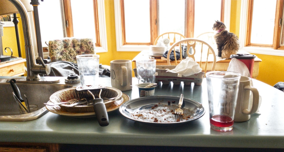 messy counter covered in dirty plates