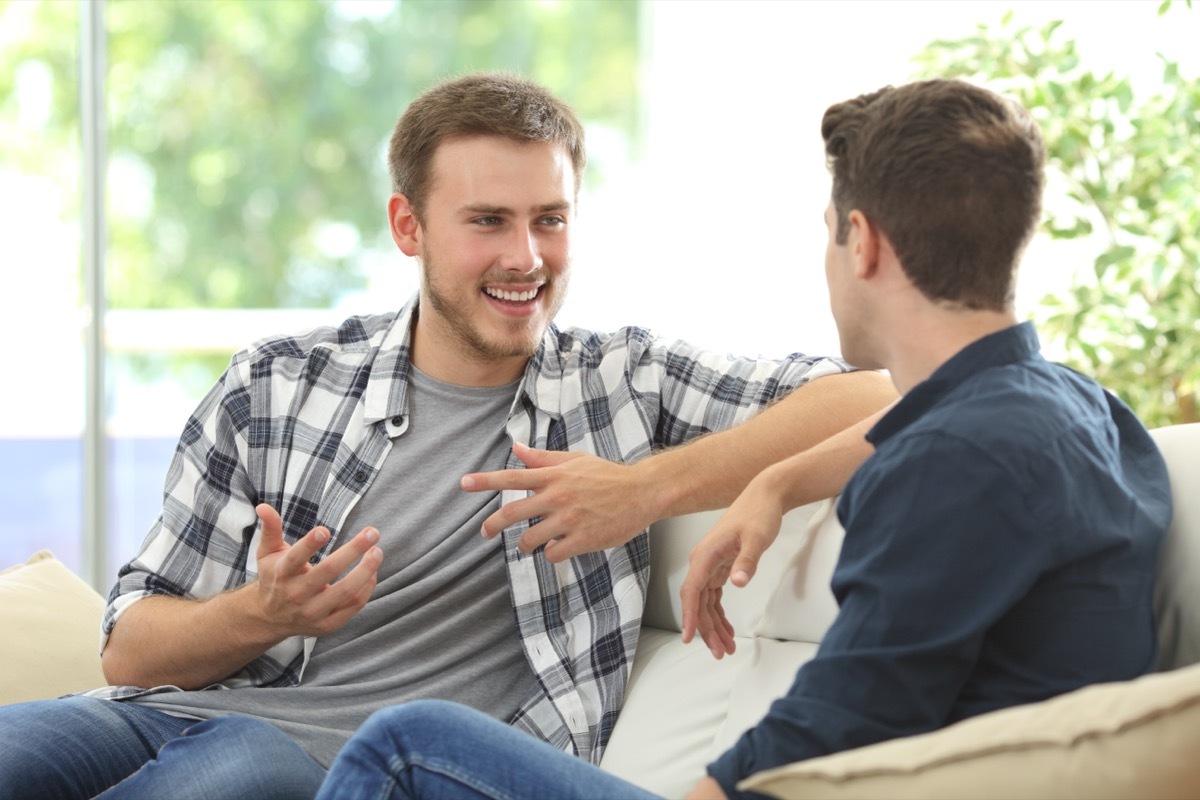 Two Friends Chatting on the Couch