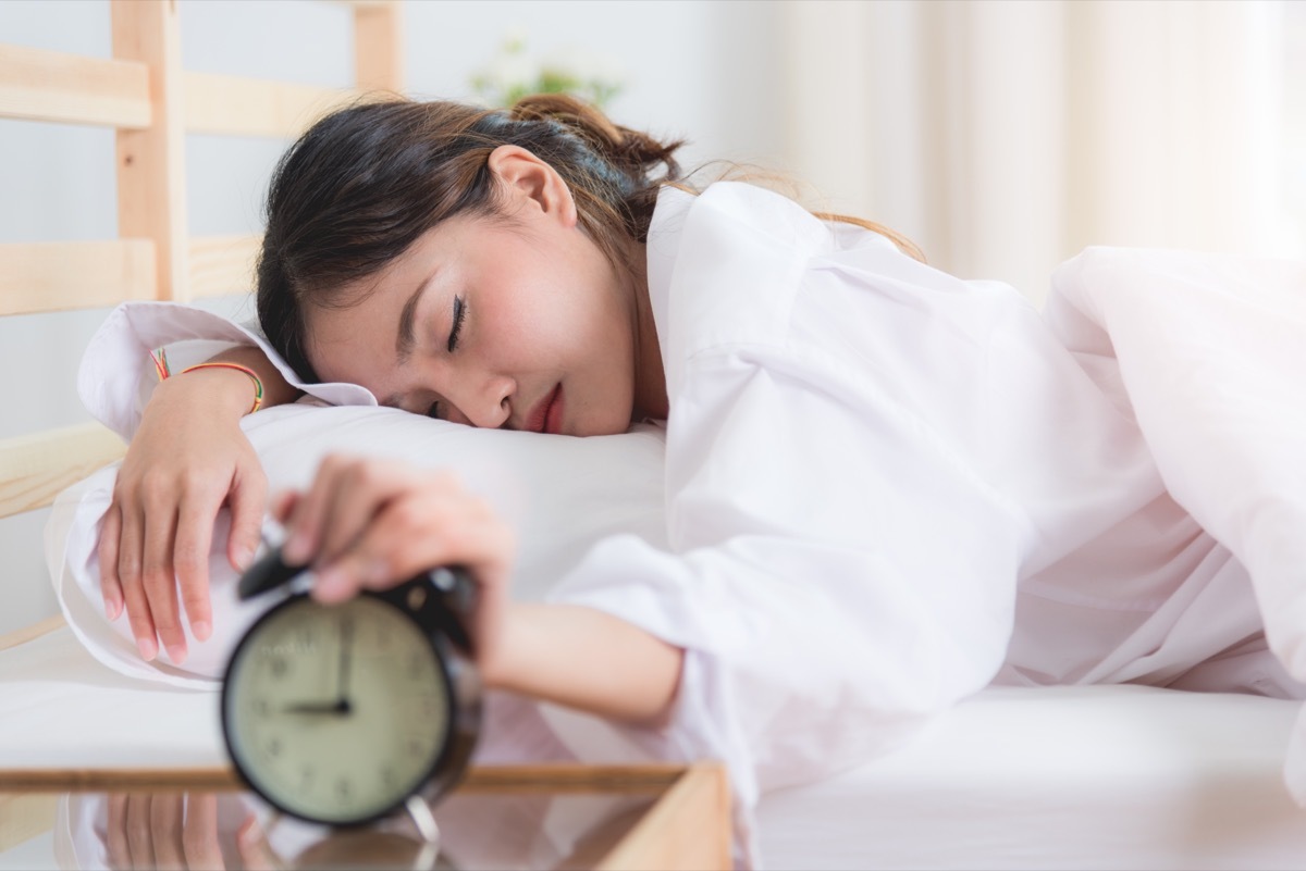 Woman Snoozing Alarm