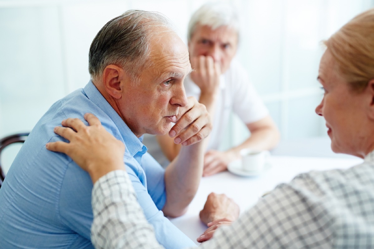 older couple arguing at table, etiquette mistakes