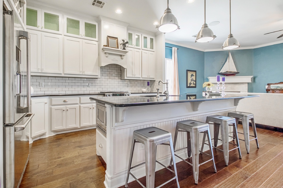 modern kitchen with island and metal barstools