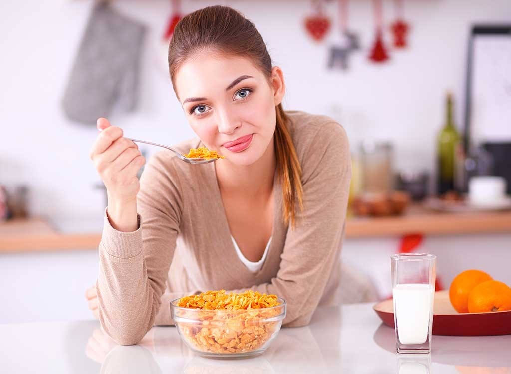 Woman eating cereal