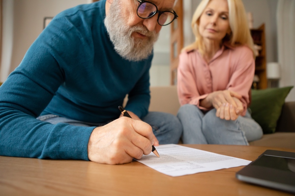 Senior couple filling out a form