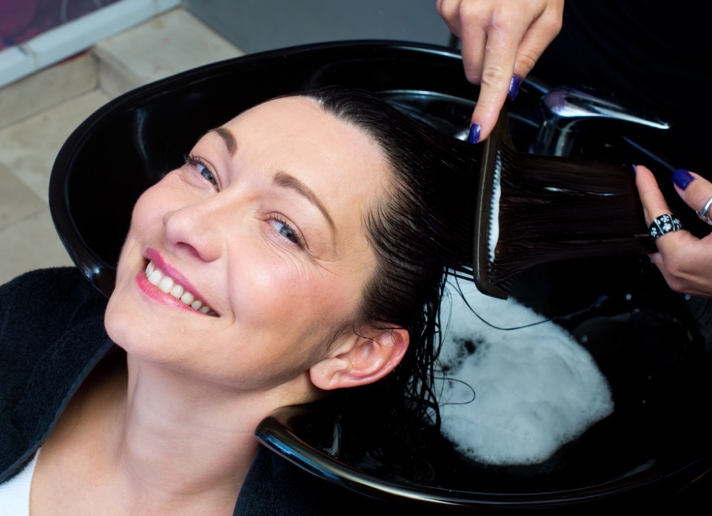 woman getting her hair done at the salon