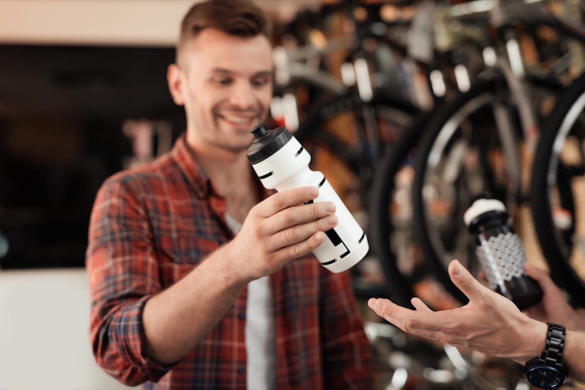 men shopping for water bottles