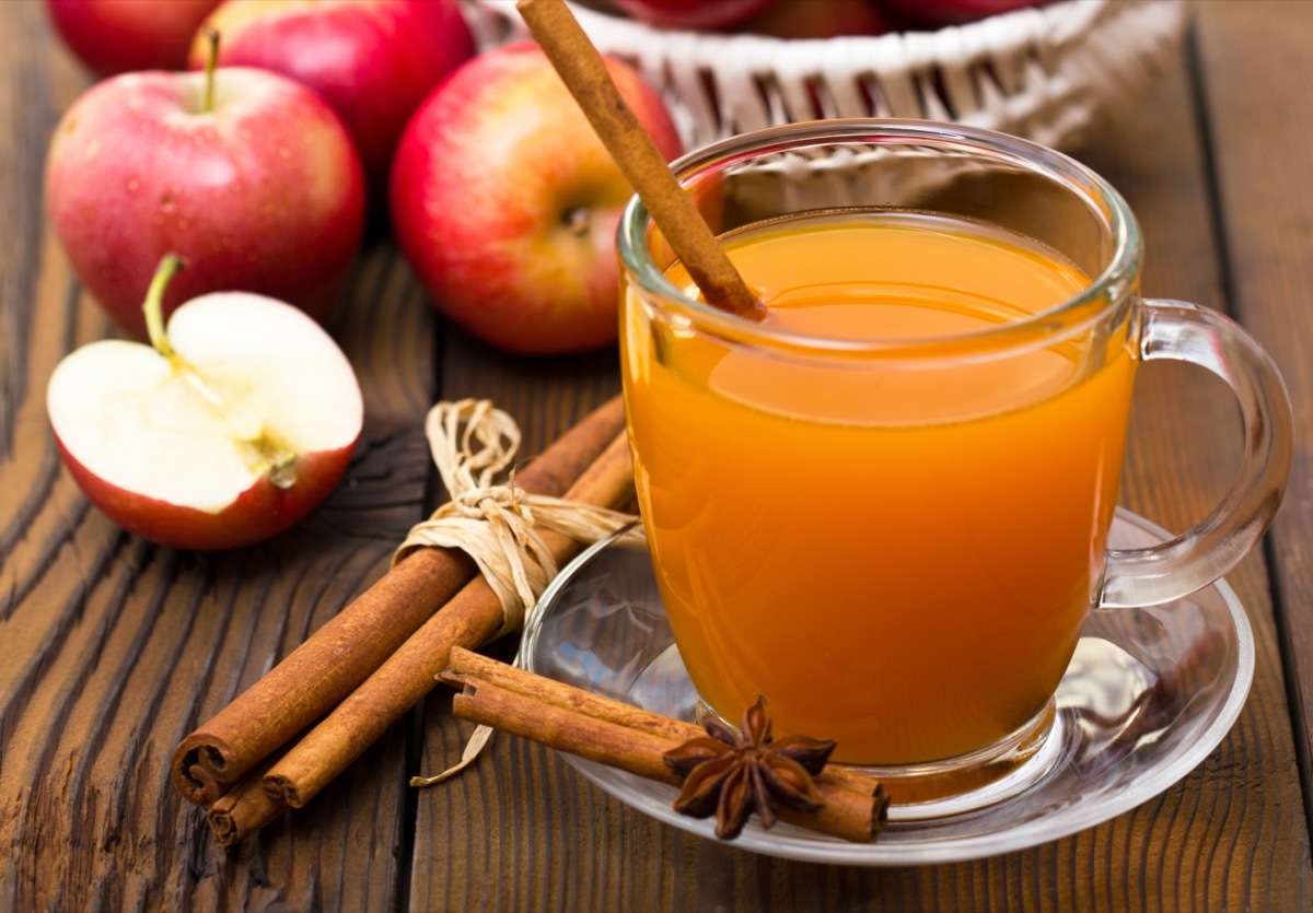 hot apple cider with cinnamon stick in mug