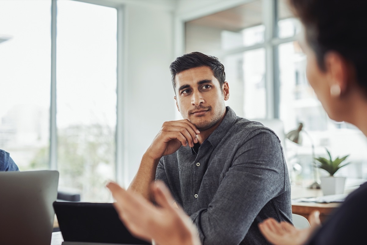 Shot of a handsome young businessman looking thoughtful during 