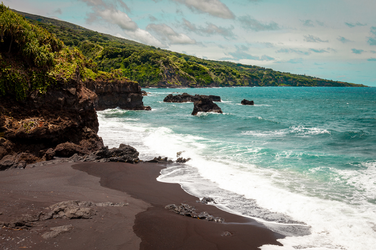 A view of a black sand beach near the Pools of Ohe'o in Haleakala National Park, Maui, Hawaii