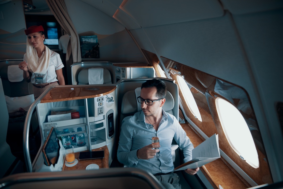 man enjoying his business class seat