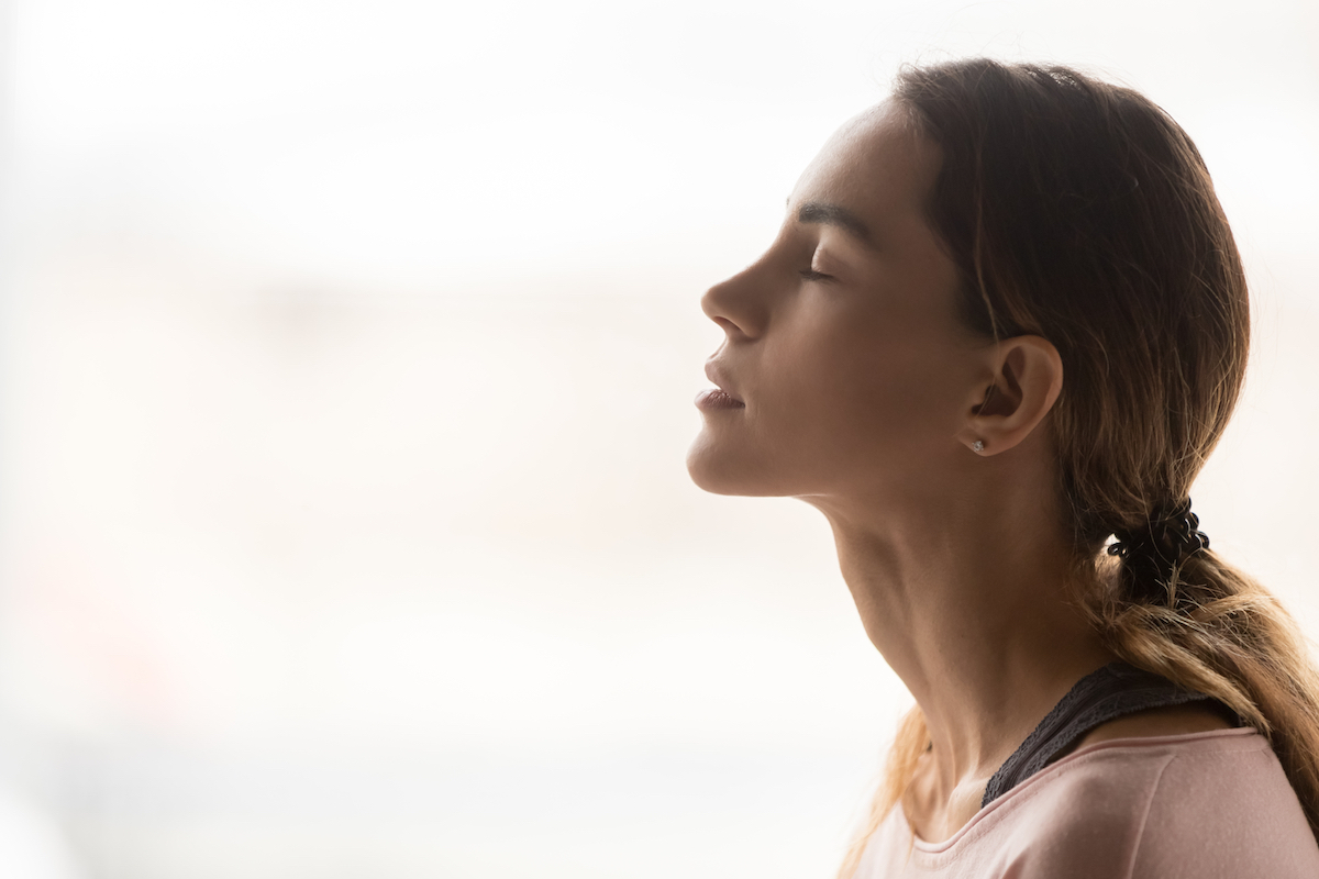 Woman taking deep breath