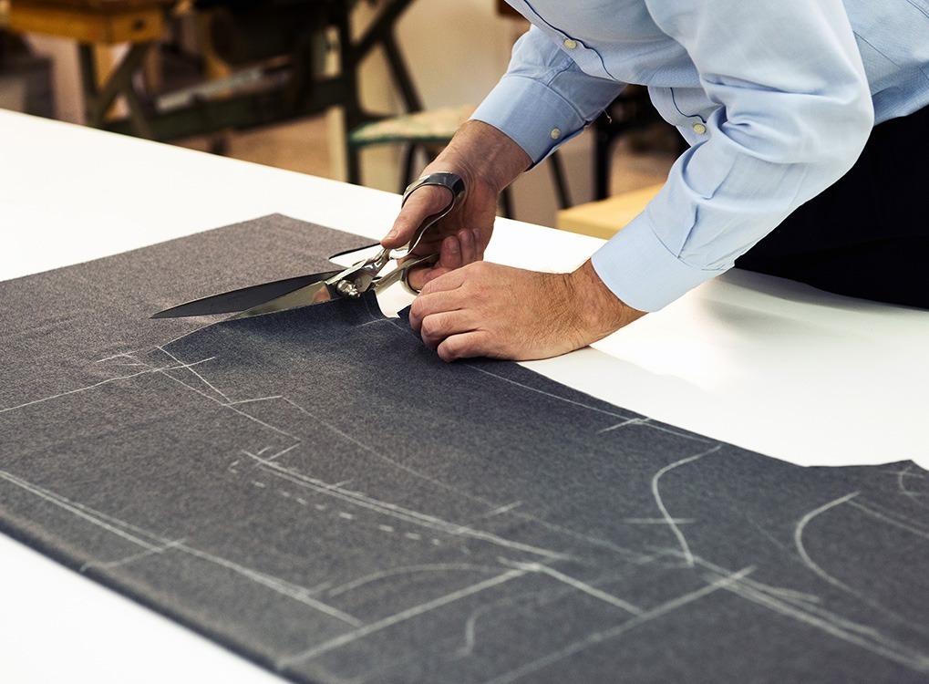 tailor making a suit