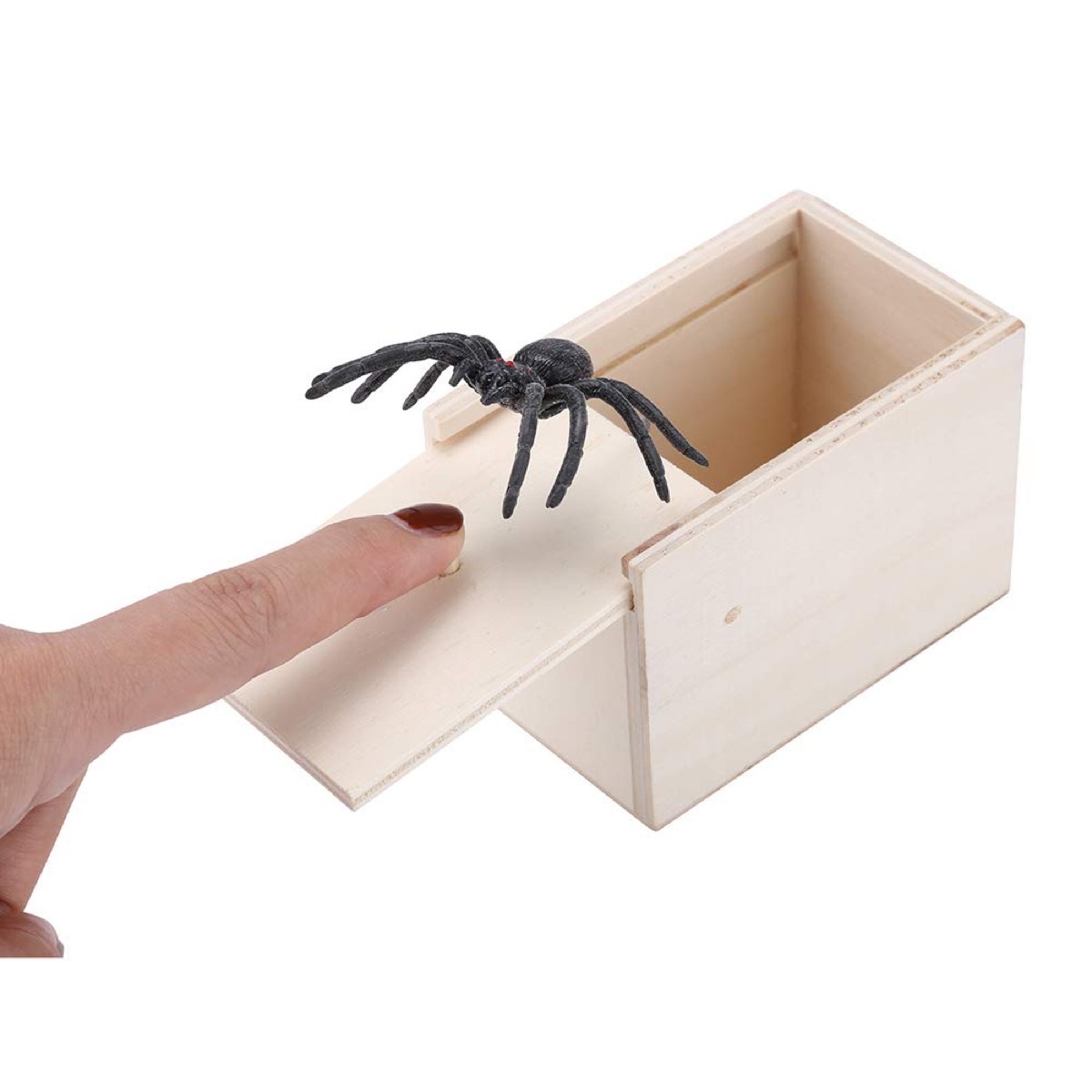 white hand and spider coming out of box