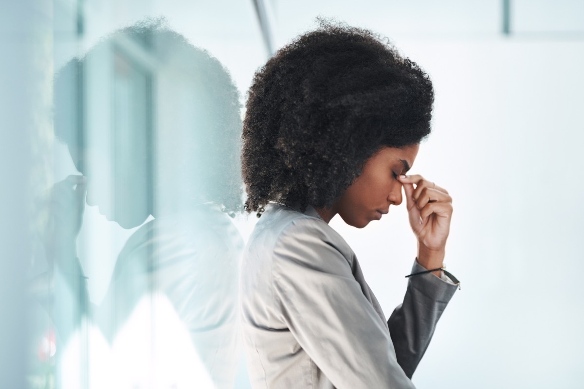 shot of a young businesswoman looking stressed out in an office