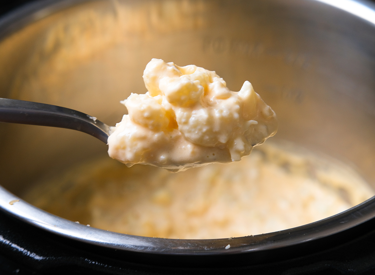 scoop of cheesy cauliflower mac and cheese from an instant pot